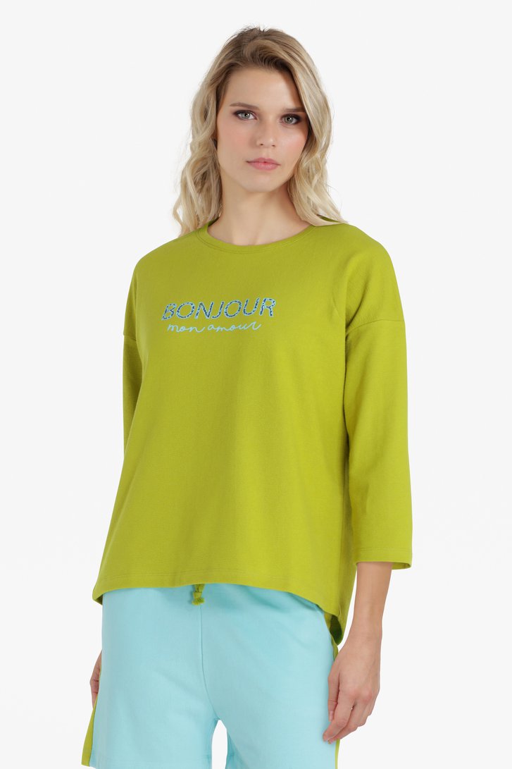 Groengele trui met opschrift
