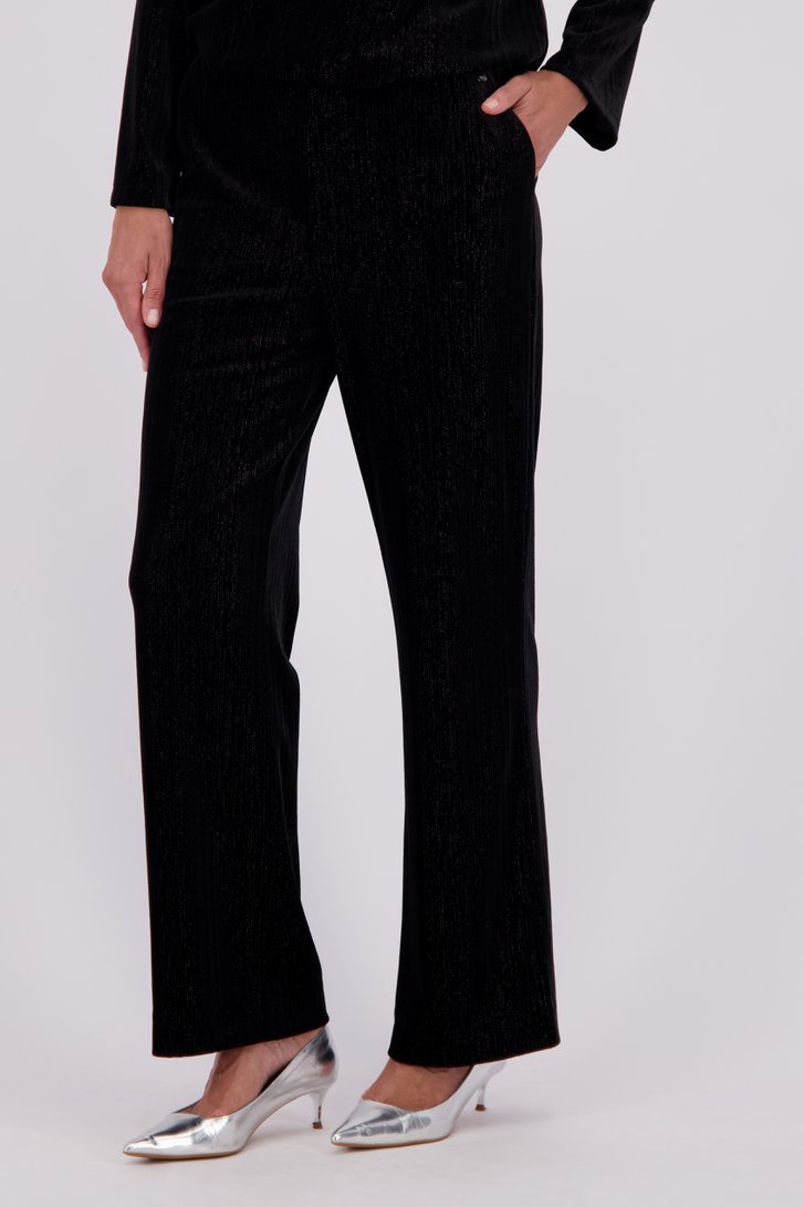 Le devant de Pantalon noir pailleté évasé de Claude Arielle pour Femmes