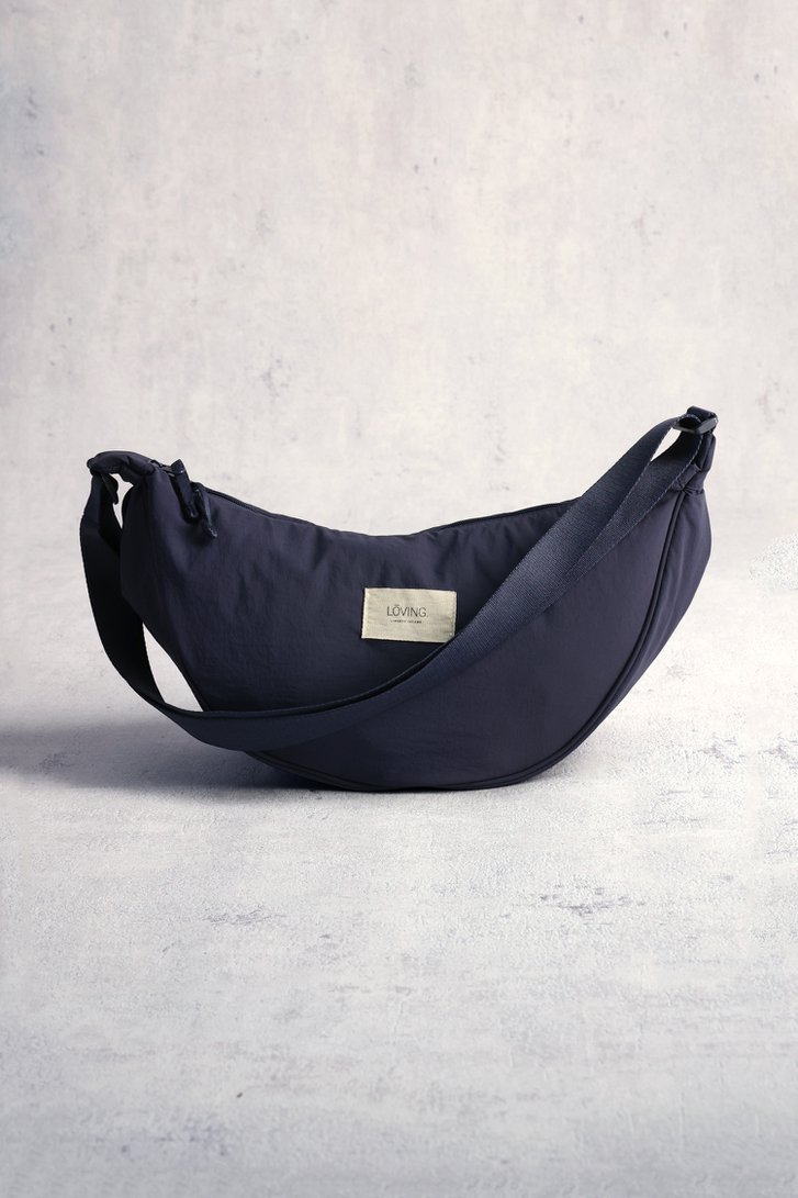 Le devant de Sac bandoulière bleu en nylon de LŌVING pour Femmes