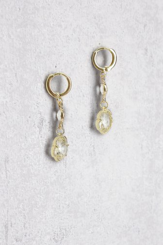 Le devant de Boucles d’oreilles dorées avec pendentif fleur de Liberty Island pour Femmes