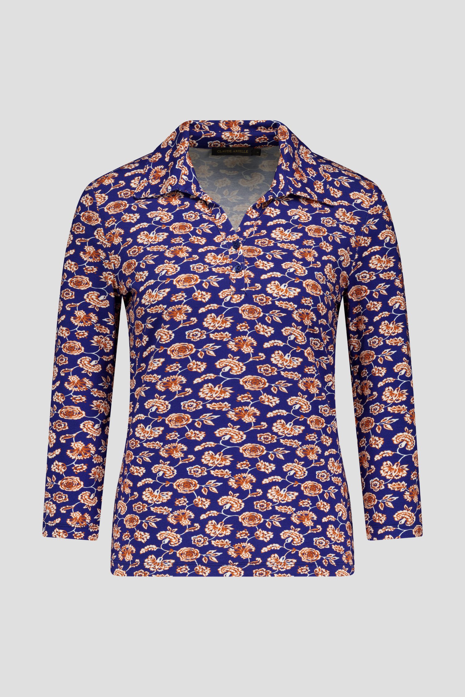 Blauwe polo met oranje bloemen van Claude Arielle voor Dames