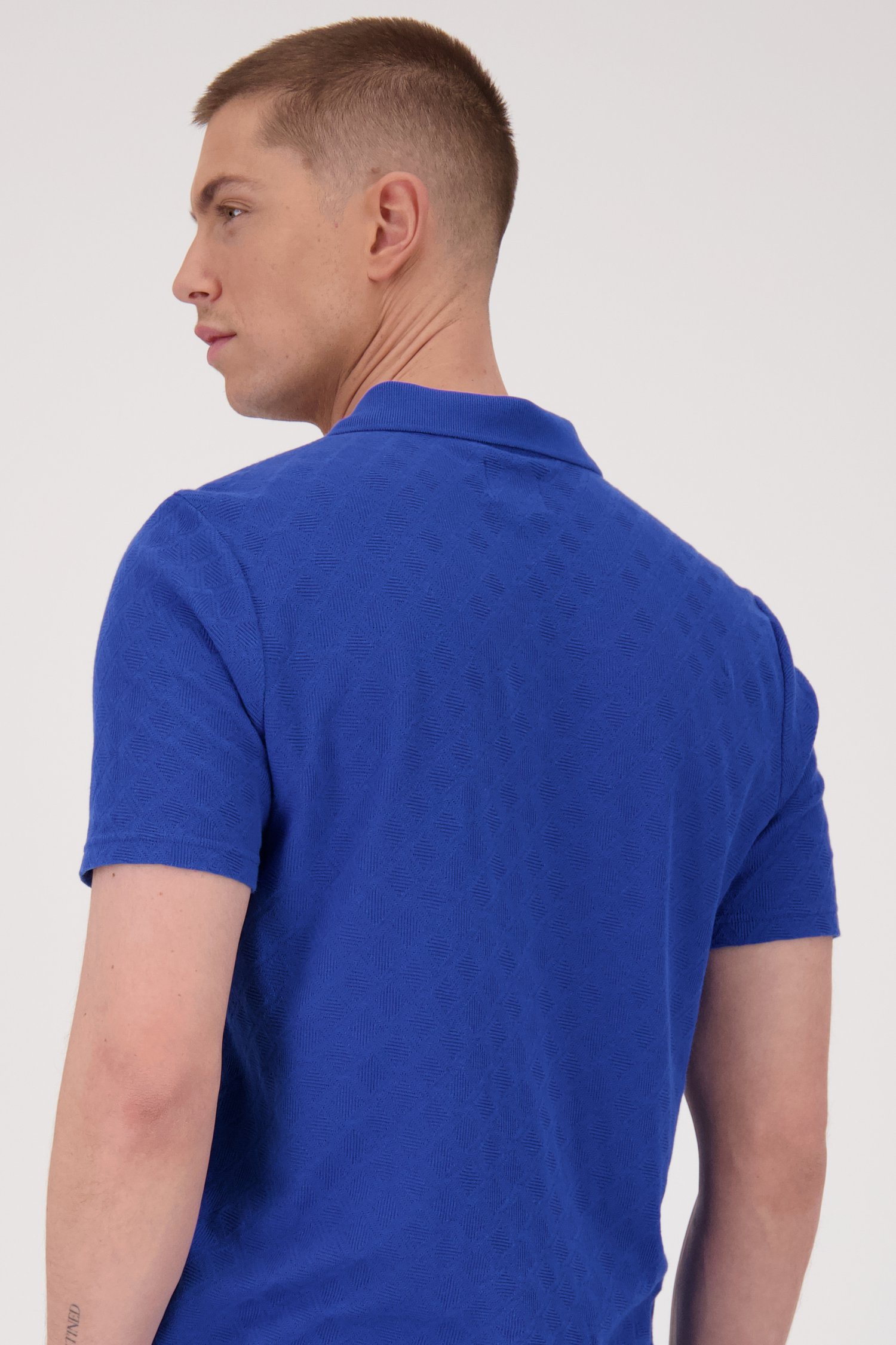 Polo bleu en tissu texturé  de Casual Five pour Hommes