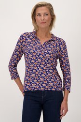 Blauwe polo met oranje bloemen van Claude Arielle voor Dames