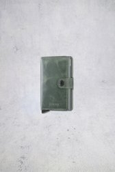 Le devant de Porte-cartes en cuir vert à l’aspect vintage de Secri pour Hommes